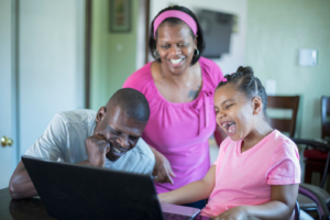 Happy family looking at a computer