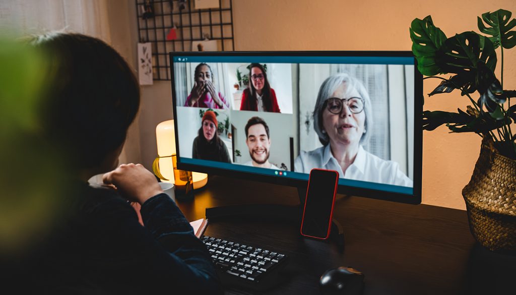 Multi generation business woman having video call with colleagues using computer app - Focus on mobile phone